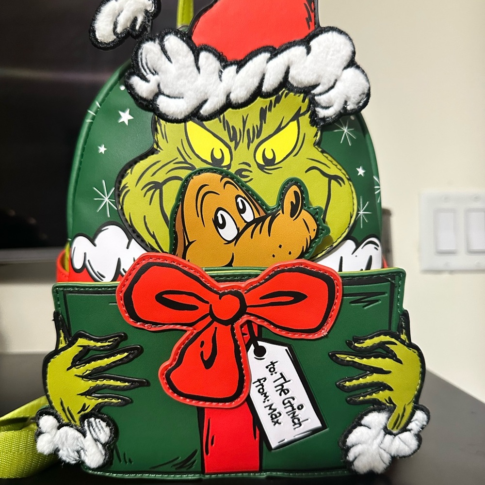 Loungefly Grinch Holiday Present Backpack in Green, Red, Yellow, White